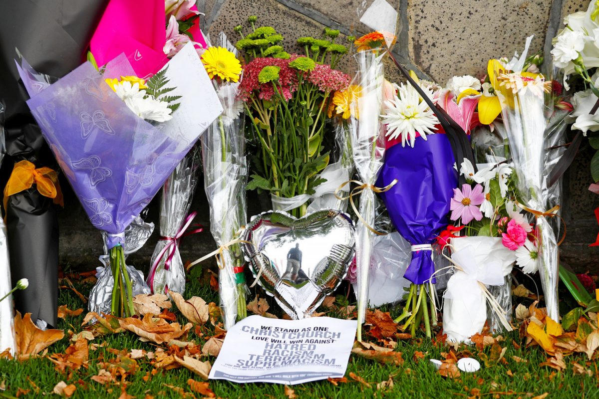 Flowers-and-signs-laid-at-a-memorial-for-victims-of-the-Christchurch-mosque-attacks-outside-Masjid-Al-Noor-in-Christchurch-New-Zealand-on-March-17-2019.-Jorge-SilvaReuters-1200x800